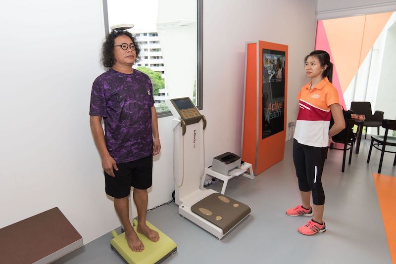 Participant getting his height and weight taken at the onboarding